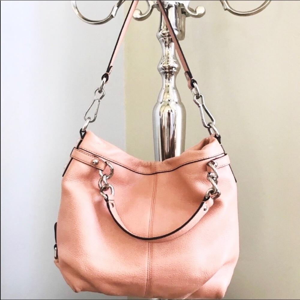 Coach Leather with Silvertone Hardware.